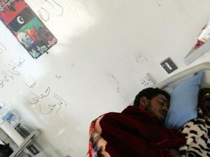 A Libyan soldier wounded from overnight clashes rests in his hospital bed on Saturday in Benghazi. AFP image