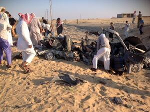 Egyptians gather near a damaged car bomb that exploded before reaching the intended target, killing three passengers on July 24, 2013 in El-Arish, in Egypt's Sinai peninsula. (AFP)