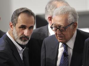Lakhdar Brahimi (R), Joint Special Representative of the United Nations and the League of Arab States on Syria, talks with Sheikh Moaz Al-Khatib, head of the Syrian oposition during the Munich Security Conference. (AFP PHOTO / THOMAS KIENZLE)