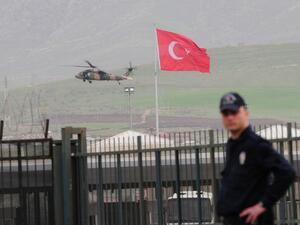 A helicopter of the Turkish army brings back Turkish prisoners over the Habur border crossing, in Sirnak, on the Turkish side, on Wednesday after they were released by the Kurdish Workers' Party (PKK). (AFP PHOTO / STR)
