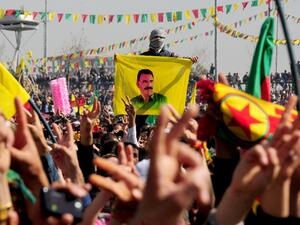 Kurds celebrate on March 21, 2013 Nowruz, the Persian New Year festival, and flash victory signs in the southern Turkish city of Diyarbakir. (AFP)