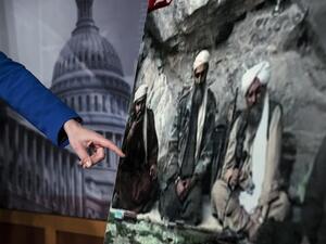 US Senator Kelly Ayotte points to a photo of Sulaiman Abu Ghaith (L) during a press conference on Capitol Hill in Washington, DC. (AFP PHOTO/Brendan SMIALOWSKI)