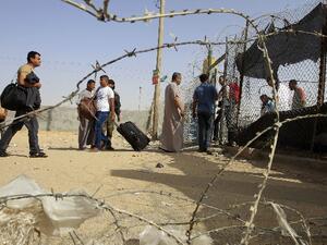 Palestinian travellers gather at the Rafah crossing with Egypt in the southern Gaza Strip on Friday after Egypt closed its borders. AFP Photo 
