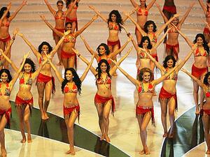 Miss World contestants dance in swimsuits in the Chinese city of Sanya in 2012. [Mark Ralston/AFP/Getty Images]