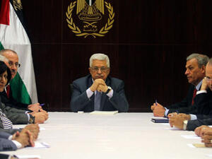 PLO's negotiator Muhammad Shtayyeh says that Israel's ongoing settlement building in Palestine "is a clear sign that [the Jewish state] is not interested in reaching an agreement [with us]" (AP)