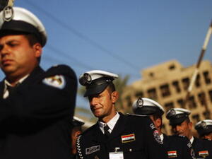 Iraqi police practice marching in preparation for ceremonies marking the departure of American troops last year in Baghdad. (Photo by Mario Tama/Getty Images)