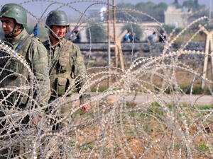 Turkish soldiers patrol in the Turkish town of Ceylanpinar near the strategic Syrian border town of Ras al-Ain late last year (BULENT KILIC/AFP)
