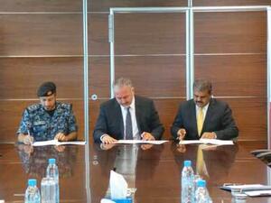 Colonel Sameer Jassim Showaiter, Mr. Mohamed Ahmed Mohamed Yateem and Mr. Silvan Varghese during the signing.