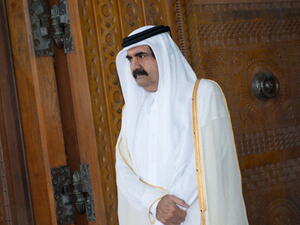 Qatari Emir Sheikh Hamad bin Khalifa al-Thani awaits for France's President Francois Hollande prior to a welcoming ceremony at the Diwan Emiri as part of a two-day official visit in Doha on June 23, 2013 (BERTRAND LANGLOIS/AFP/Getty Images)