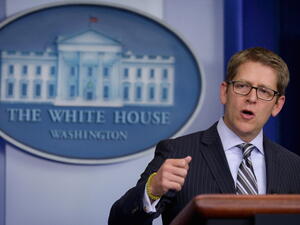 White House Press Secretary Jay Carney warned that if the new legislation to impose fresh sanctions on Tehran is enacted, “the president would veto it.” [Getty Images]