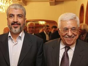 Hamas Political Bureau Chief Khaled Meshaal and acting Palestinian Authority chief Mahmoud Abbas [Ma'an]
