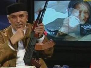 Libyan State TV presenter shows the rebels who's the boss.