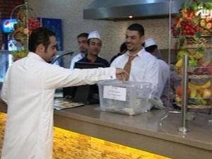 Paying a fine for not finishing his food. [via Alarabiya]