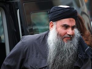 Abu Qatada, seen here in an old photo before he was brought back to Jordan for his trial, is charged with conspiring to carry out a terrorist attack on the American school in Amman, among other things. (AFP/File)