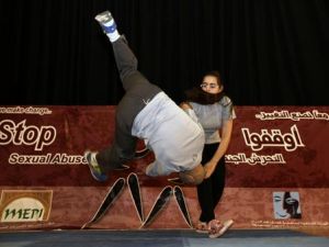 A girl demonstratesher newly acquired Aikido skills