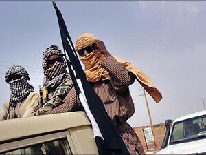 Fighters from al-Qaeda splinter group MUJAO watch Gao airport on August 7th. Al-Qaeda central is reportedly shifting operations from Afghanistan to North Africa. (AFP/Romaric Ollo Hien)