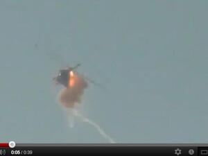 Screenshot from the video appearing to show a helicopter shot down in Aleppo