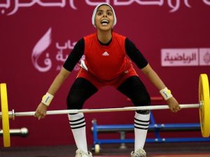 Noof Omar of Yemen attempts the women's 53 kg! (Image courtesy of "newsobserver.com")