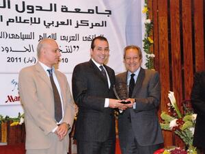 Haitham Nassar, Ramses Hilton General Manager, receiving the Award