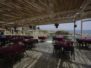 With its isolated coffee shops and restaurants, Beirut seems to have lost its old charm. Pictured: an empty Beirut Restaurant.
