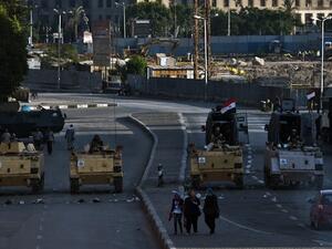 Egyptian army armoured personnel carriers (APC) are seen stationed in front of the Egyptian Museum in Tahrir Square on August 18, 2013 in Cairo. (AFP)