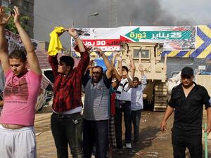 Egyptian security forces detain demonstrators after a crackdown on a protest camp by supporters of ousted president Mohamed Morsi and members of the Muslim Brotherhood on August 14, 2013 in Cairo's Rabaa al-Adawiya mosque. (AFP)