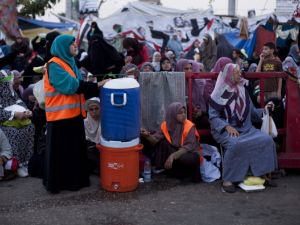 Supporters of deposed Egyptian President Mohammed Morsi wait prior to the 'iftar' fast-breaking meal at a sit-in protest at the Rabaa al Adweya Mosque in the Nasr City district on July 28, 2013 in Cairo. (Getty images)