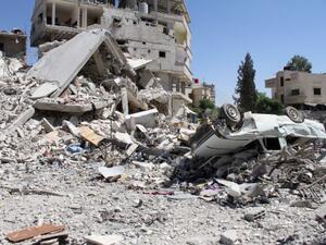Large areas of Damascus have been destroyed by car bombs and other violent attacks. Here, a pile of rubble is seen following a car bomb in June. (AFP/File)