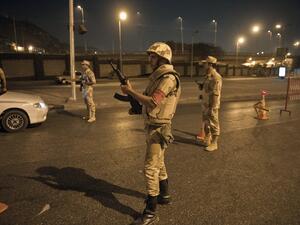  Egyptian troops keep watch at a checkpoint during the curfew hours in Cairo late on August 19, 2013
