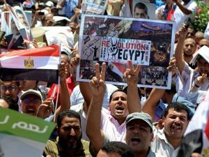 Supporters of Egypt's ousted president Mohamed Morsi take part in a demonstration in Alexandria, Egypt, on July 26, 2013 (AFP)
