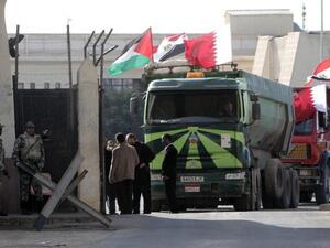 An Egyptian truck loaded with gravel prepares to enter through the Rafah border crossing, between Egypt and Gaza Strip, on Saturday. (AFP PHOTO / SAID KHATIB)