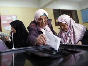 Egyptian women cast their votes in Cairo, for the referendum, 2012
