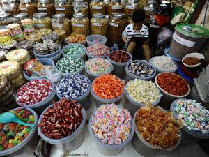Sellers are preparing cookies, candies, pickles fruit and vegetables for Eid at Atum Market in Surabaya, Indonesia. (Getty)