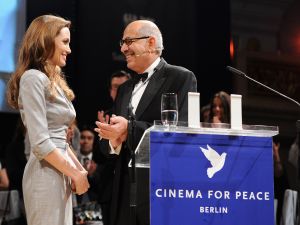 Mohamed ElBaradei and Angelina Jolie at the The Cinema of Peace Gala, where the famous kiss occurred.