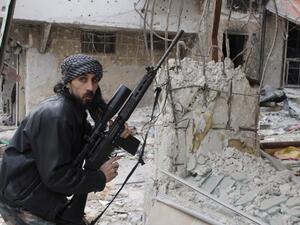 Roughly 1,300 of the fighters are members of IS, while the rest are mainly members of al Nusra Front. (AFP/File)