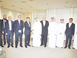 Emile Habib of Gulf Related with Yasir Abu Sulayman of NCB and senior executives.