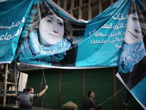 A banner for parliamentary candidate Gamila Ismail near Tahrir Square.