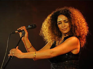 Big hair, big voice - Ghalia Ben Ali performs at Hayy Festival. (Image: Facebook)