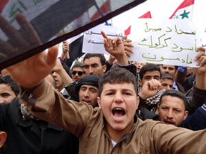 Iraqis shout slogans during an anti-government protest at the end of Friday prayers in the ethnically mixed city of Kirkuk,  north of Baghdad. Thousands of people in Sunni-majority areas of Iraq called for the government's fall amid a spike in violence that has accompanied a political stalemate two months before provincial polls. (AFP Photo/Marwan Ibrahim)