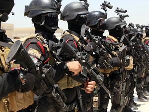 Iraqi special forces take part in a drill simulating a hostage rescue operation on Thursday at an Iraqi base in Baghdad. (AFP)