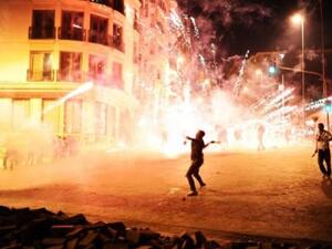 Protesters clash with Turkish riot policemen on the way to Taksim Square in Istanbul on Wednesday. AFP Photo