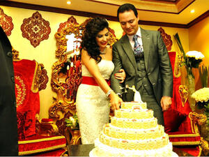 Cutting the cake: Jumana and Rabi married in an intimate ceremony last month. (Image: Facebook)