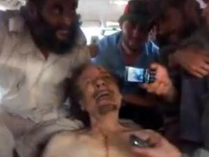 A video still apparently showing Qaddafi's corpse