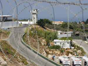 A picture taken through barbed wire on August 10, 2013 shows the base of the Turkish engineering construction company, an unit of the United Nations Interim Force in Lebanon (UNIFIL) in the southern Lebanese village of Saitah. (AFP/MAHMOUD ZAYYAT)