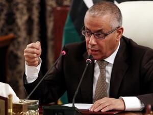 Libyan Prime Minister Ali Zeidan gives a press conference on November 10, 2013 in Tripoli. Zeidan warned Libyans of the possibility of foreign powers intervening unless the country's current chaos ends in Benghazi. (AFP)
