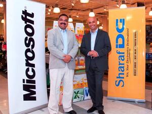 Samer Abu-Ltaif, Microsoft Gulf Regional Manager, with Nilesh Khalkho, CEO of Sharaf DG