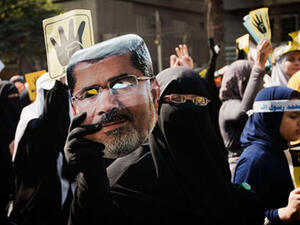 Cairo expelled the Turkish ambassador in August following Ankara's PM Erdogan's condemnation of Egypt's violent crackdowns on Morsi supporters (Gianluigi Guercia/AFP)