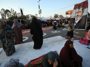 Egyptian female supporters of Egypt's deposed president Mohamed Morsi are seen during their ongoing sit-in protest outside Rabaa al-Adawiya mosque in Cairo on July 31, 2013. (AFP)