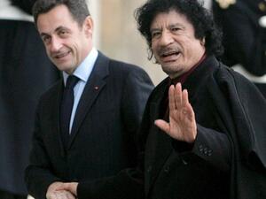Nocolas Sarkozy cozies up with the late Gaddafi