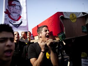 Protesters remember the victims of Port Said in light of the anniversary of Mubarak's resignation.
